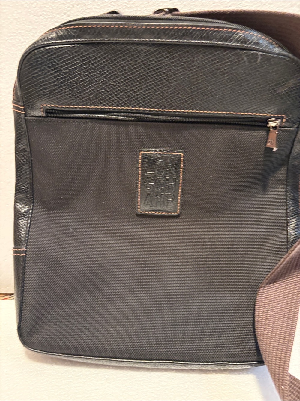 Longchamp Men's black canvas and leather messenger bag with Front Zip Pocket